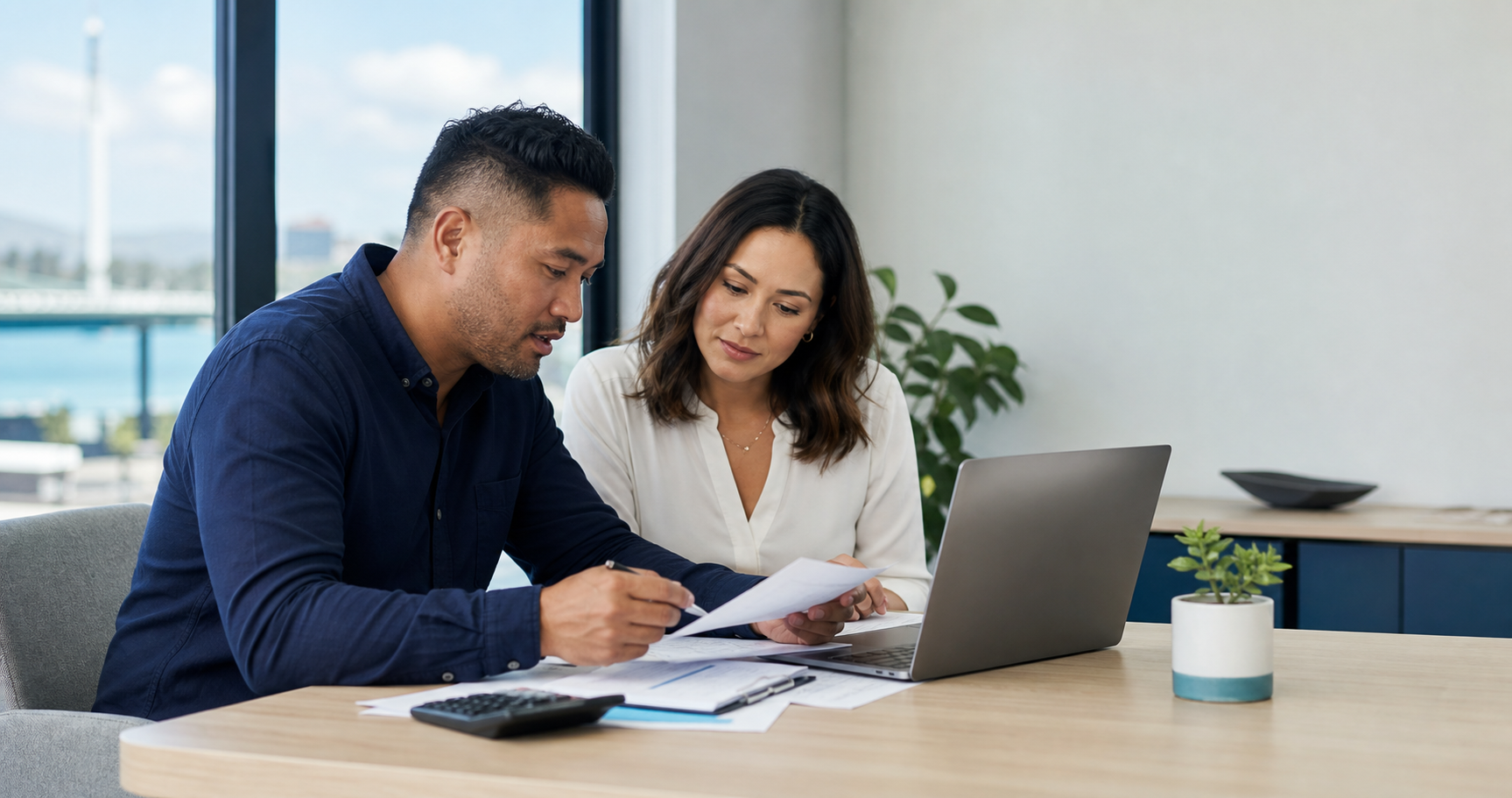 An accountant reviewing business records with a client